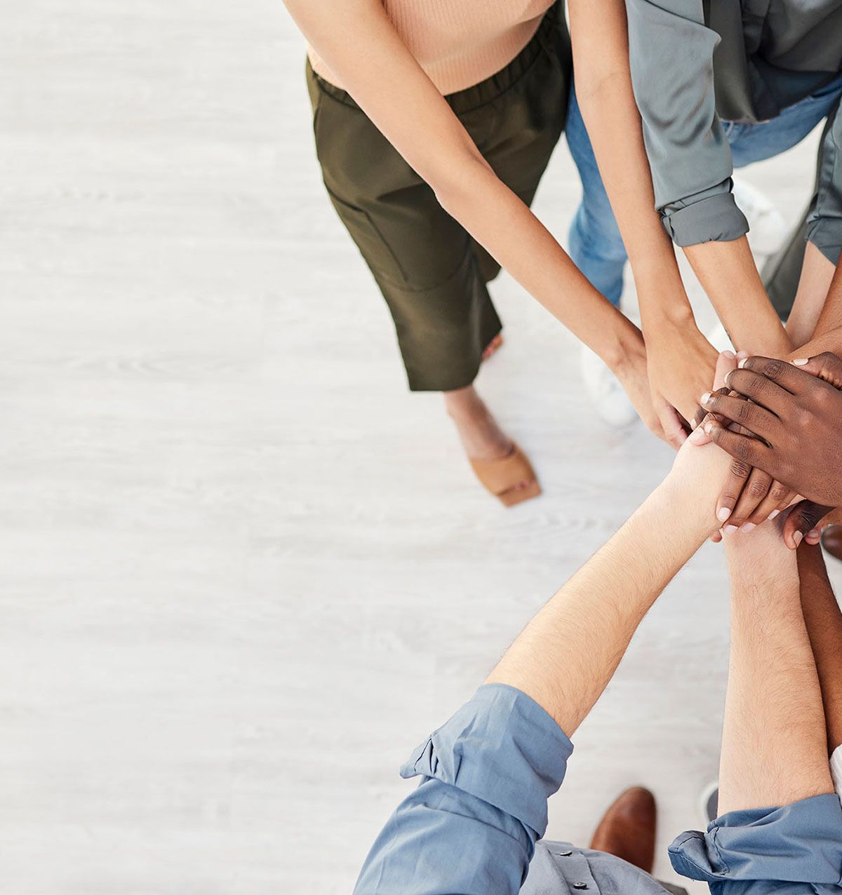 Arrowsmith Community Justice Society team with hands together