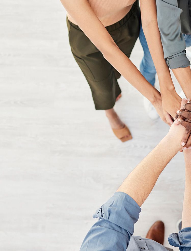 Arrowsmith Community Justice Society team with hands together